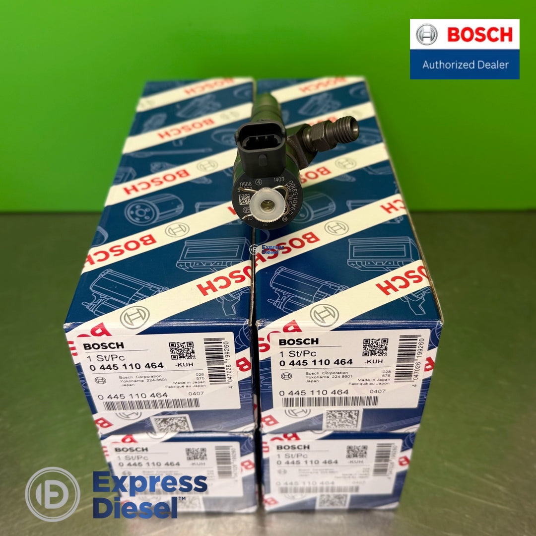 Top view of Bosch 0445110464 CRI2-16 injector solenoid electrical connector over a set of four original Bosch boxes for Yanmar 4TNV86CT engines