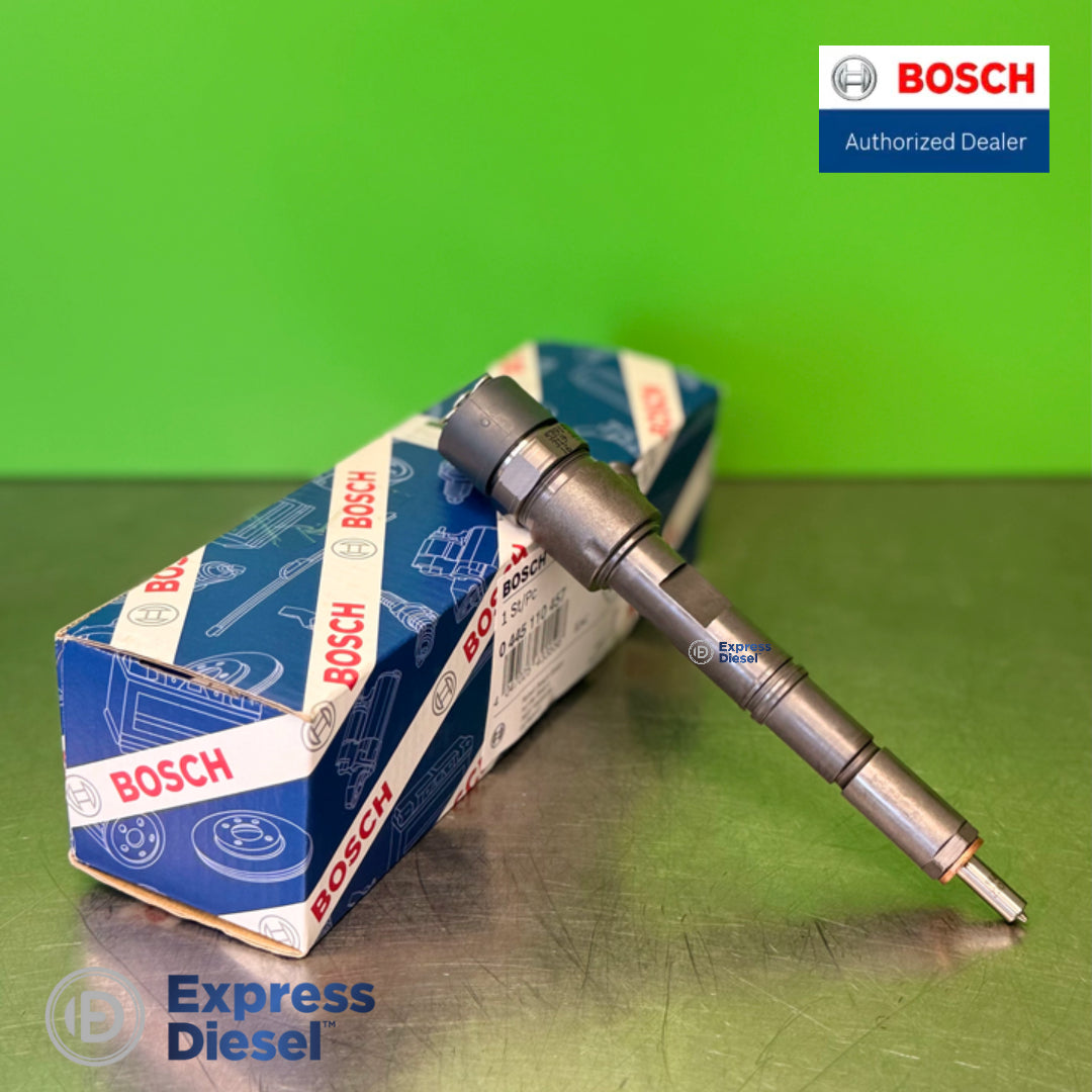 Bosch 0445110457 common rail injector - side profile resting on the Bosch box