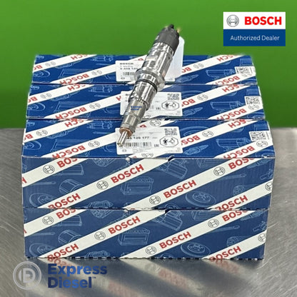 Set of 6 genuine Bosch 0445120177 CRIN common rail injectors for Cummins QSB ISB 6.7L on a stack of original Bosch OEM boxes