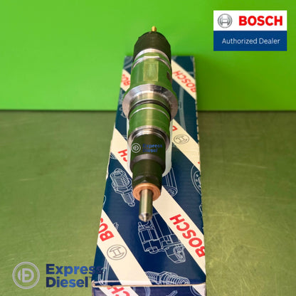 Top-down view of the Bosch 0445120177 injector body and sealing lands, Cummins 5254261 common rail injector on the Bosch box